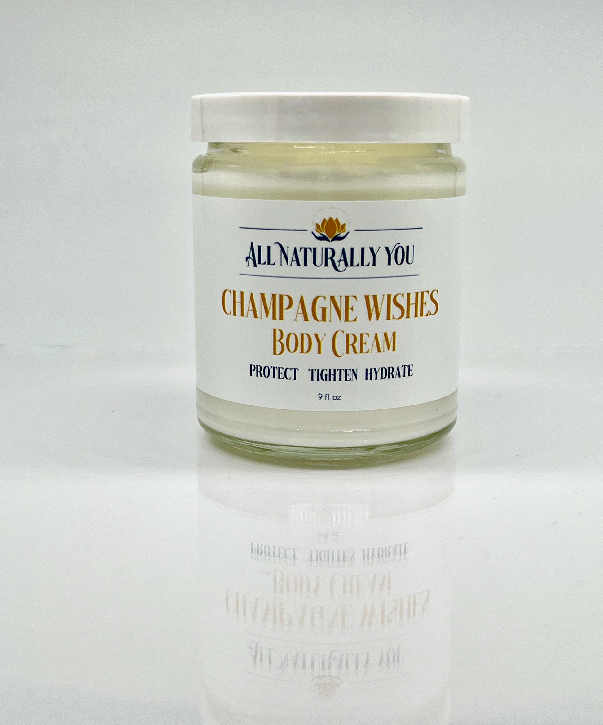 Champagne Wishes Moisturizing Body Cream in a 9 oz jar, luxury skincare with vitamins, antioxidants, and fatty acids for hydrated, protected skin.